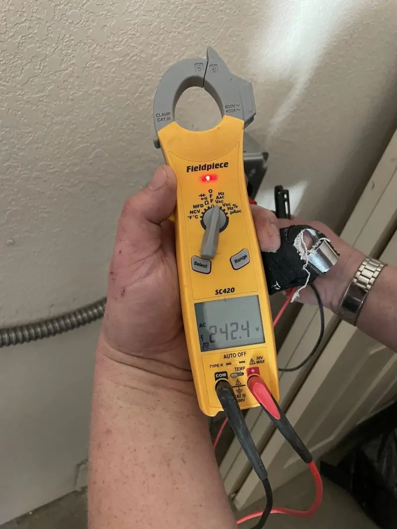 Voltage testing with clamp meter during Recessed Lighting Installation in Chipley